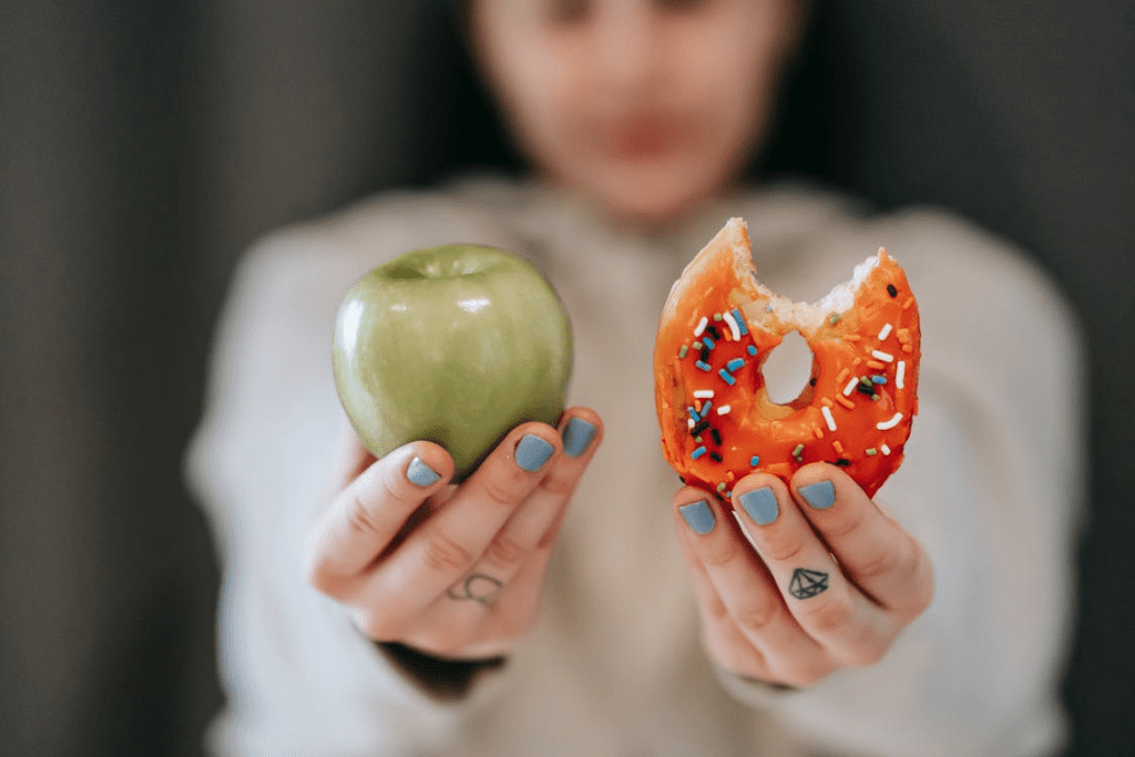 a woman holding two food items