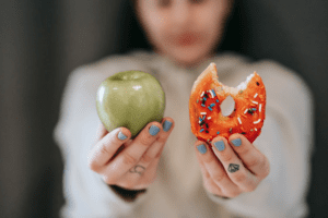 a woman holding two food items