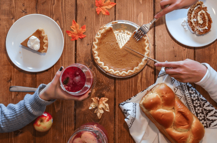 A dinner table with pumpkin pie