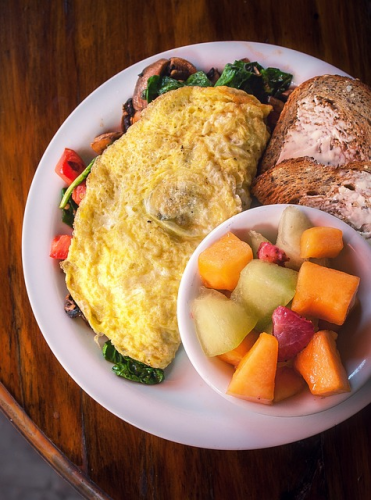 spinach omelet with fresh fruit bowl