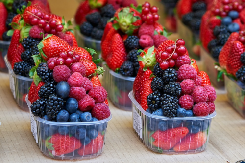 assorted berries in small containers
